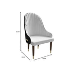 Chaise de salle à manger en cuir avec dossier ondulé et accents dorés Collection Elara