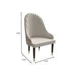 Chaise de salle à manger en cuir avec dossier ondulé et accents dorés Collection Elara